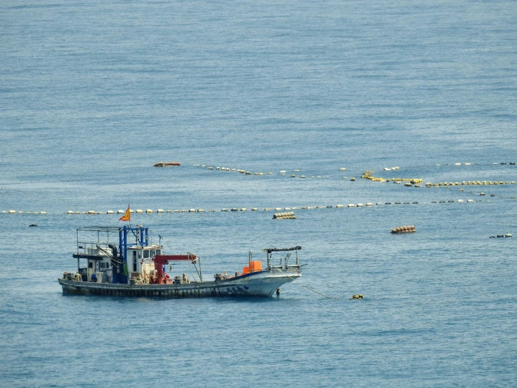 a fishing boat that is out in the open