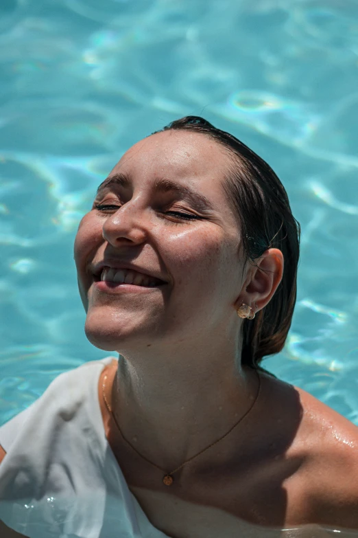 a woman is floating in the water