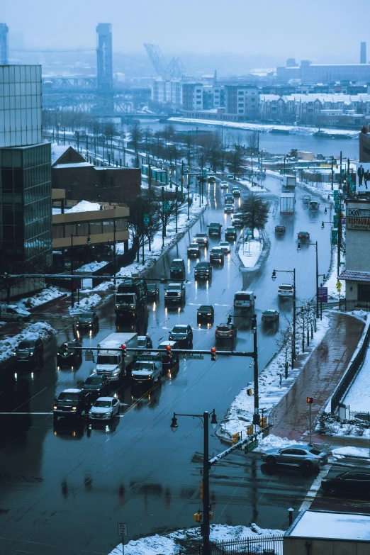 a flooded city street at night with streetlights and street lights on it