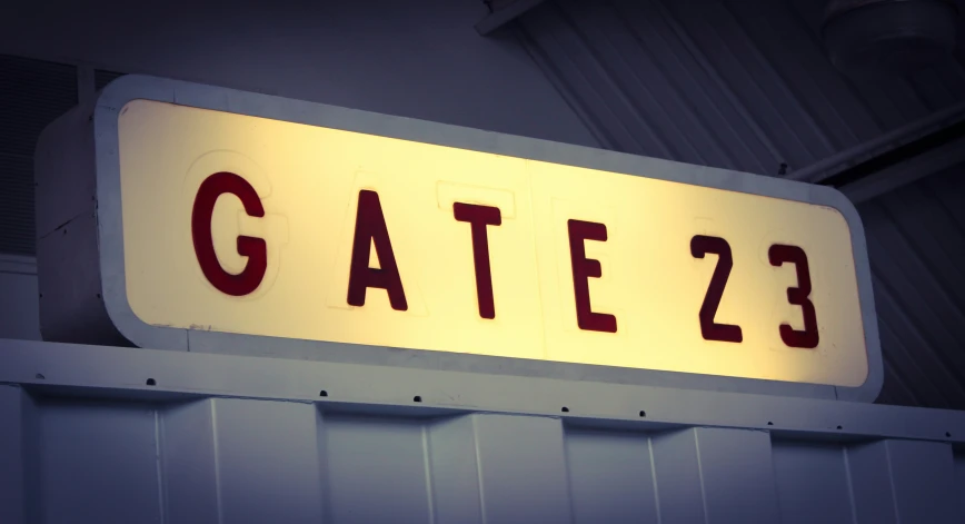 an open sign that reads gate 23 on it