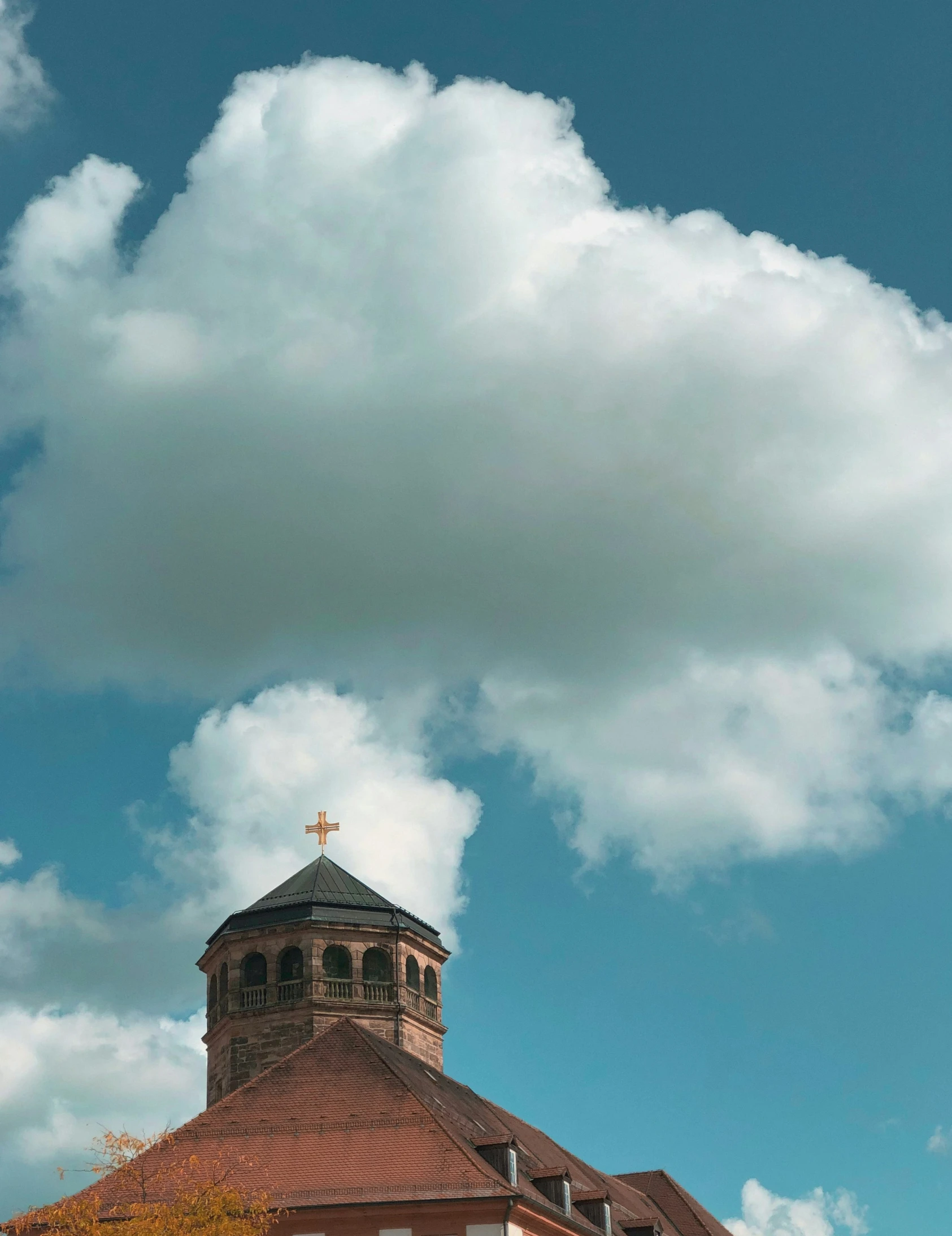 an empty steeple with the tops down in front of a building