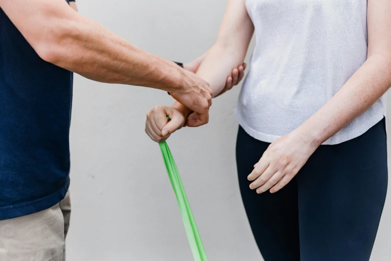 a man and a woman hold the ends of an umbrella