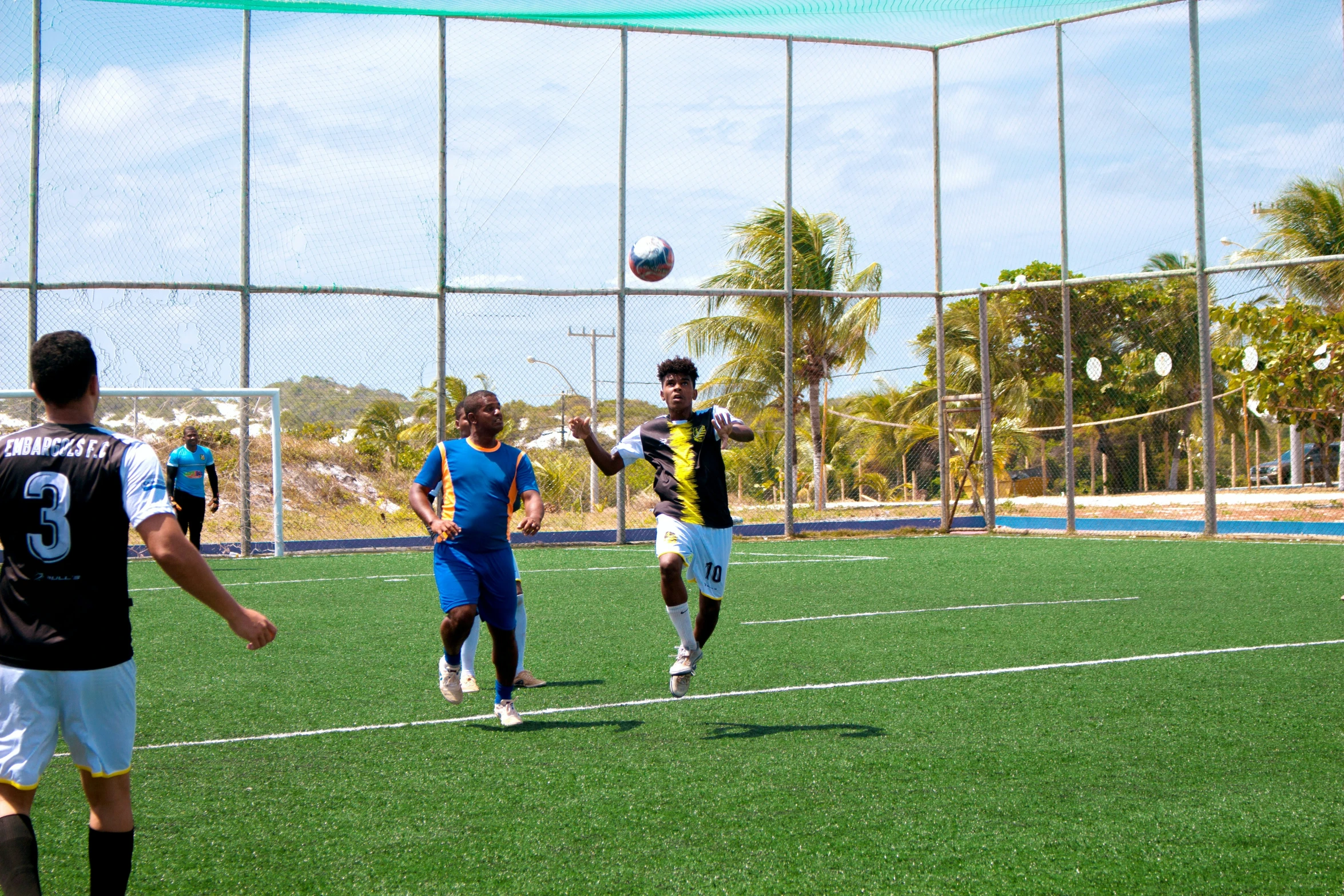 a group of men playing soccer against each other