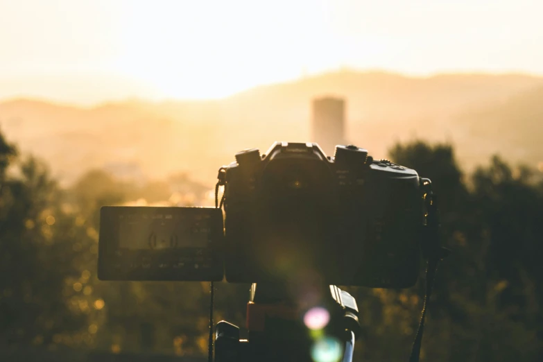 the camera on top of a tripod set up for a po