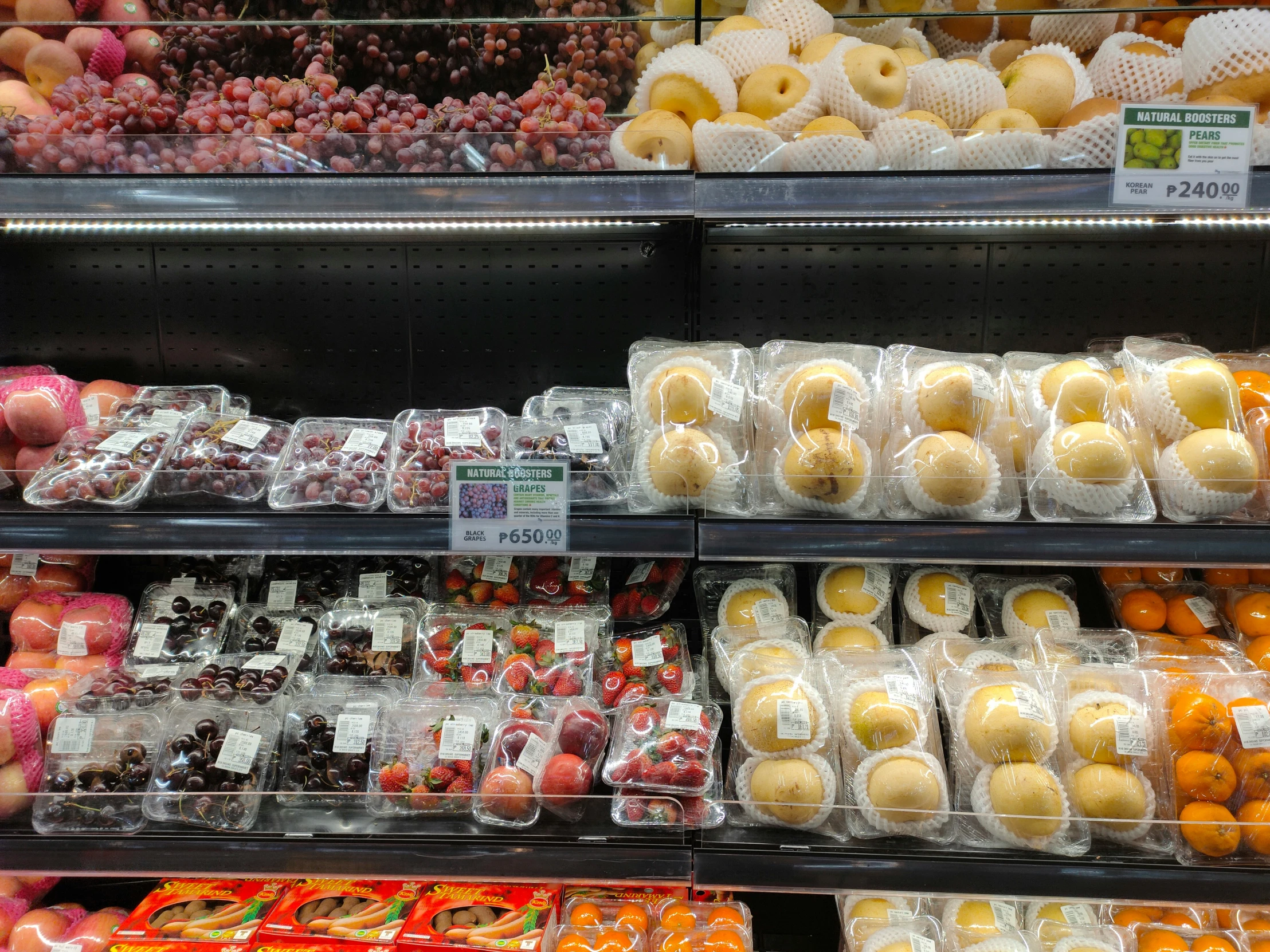 shelves with assorted donuts in a store