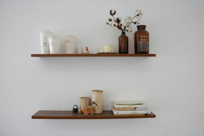 some wood shelves are lined up on the wall