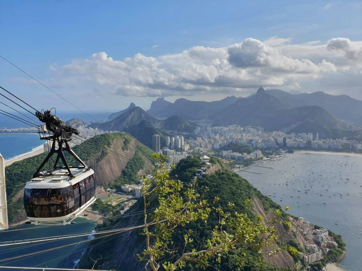 a cable car on a cliff over the water