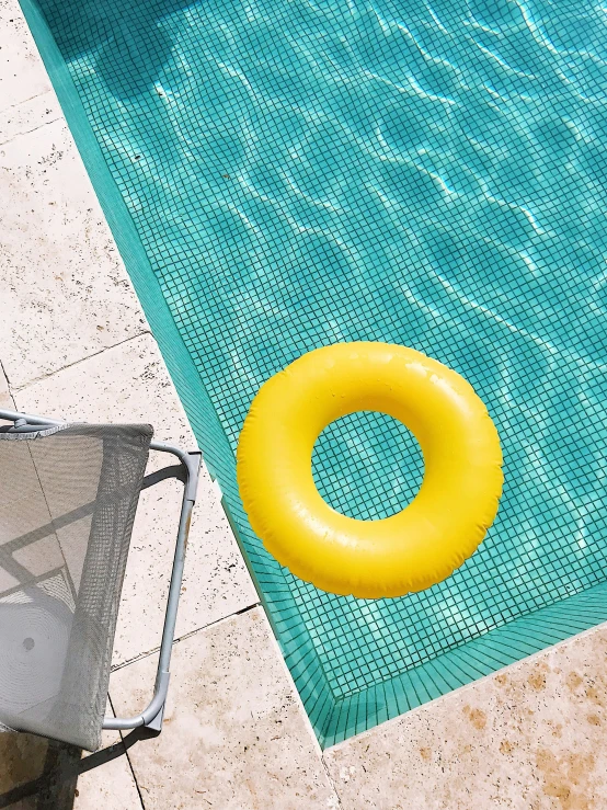 an orange ring on the edge of a swimming pool