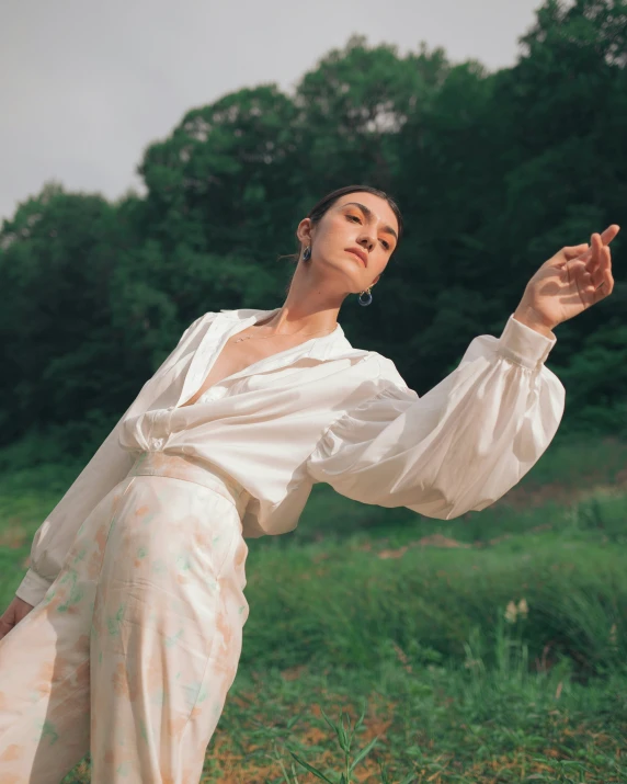 an image of a woman standing in the middle of a field