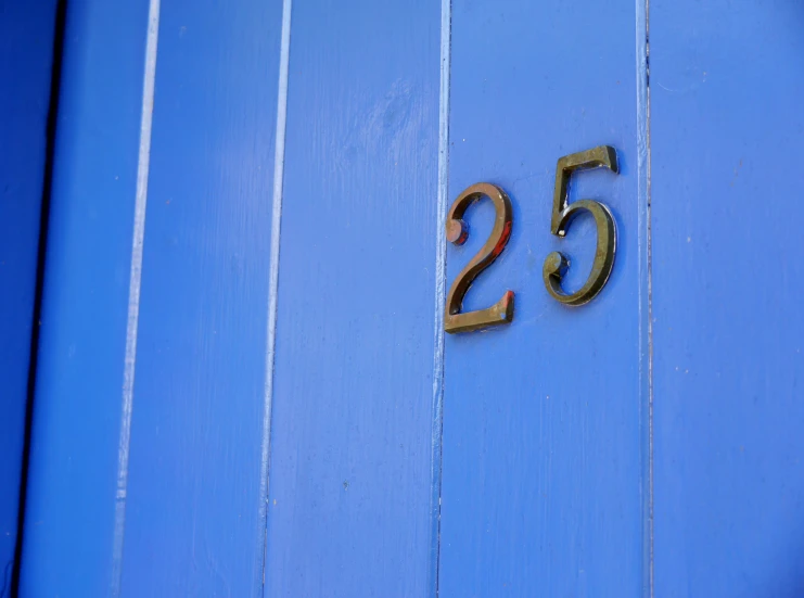 a number is sitting on the door of a house