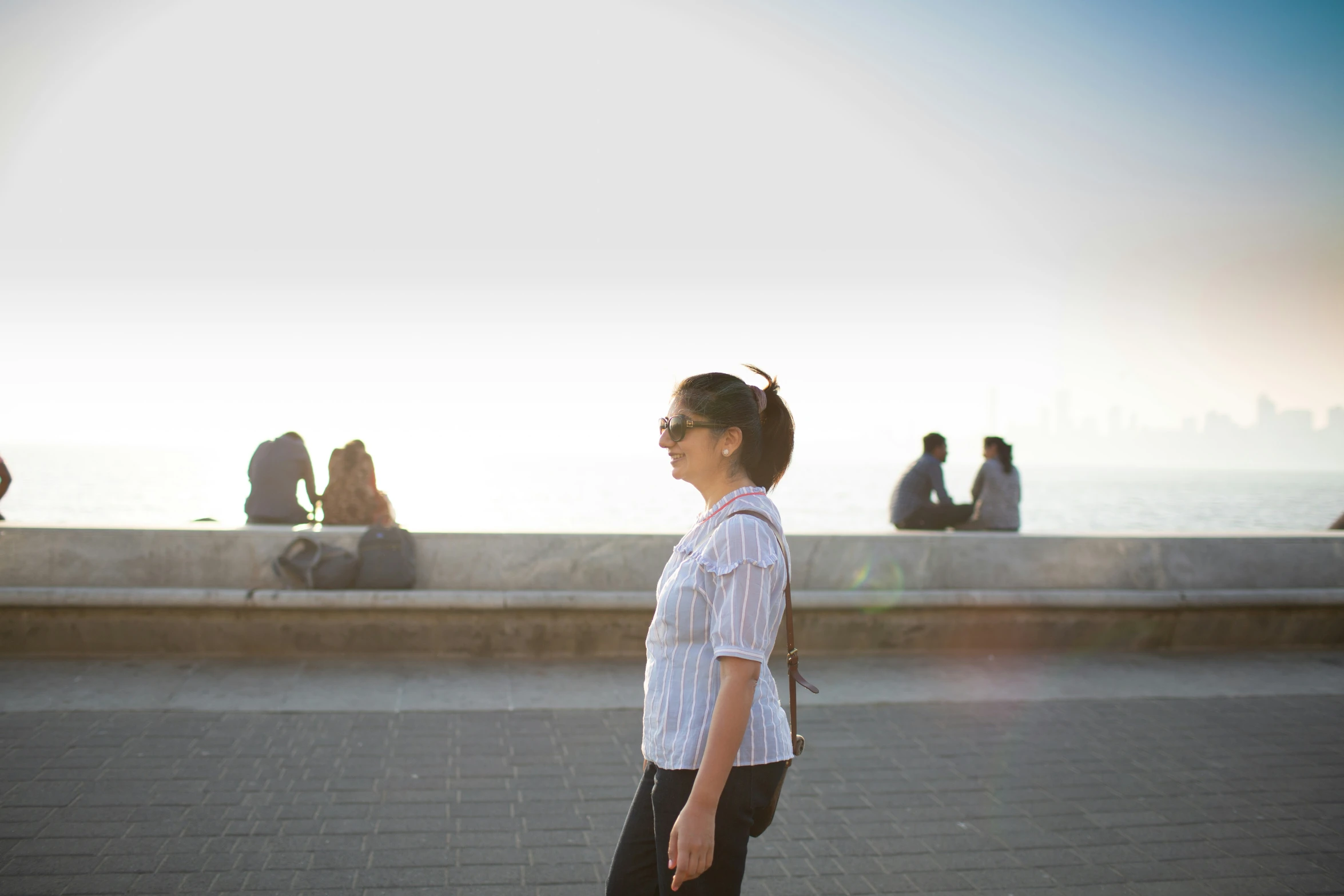 an image of a woman standing on the sidewalk