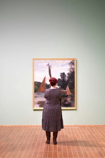 a woman wearing a purple dress and a hat in front of paintings