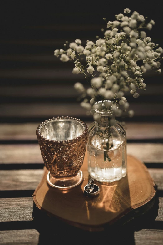 a vase sitting on top of a wooden table