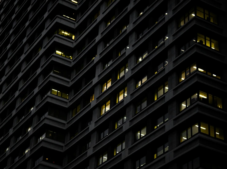 an illuminated building in the dark at night