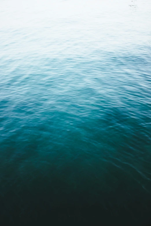 some water and one boat that is going in the distance