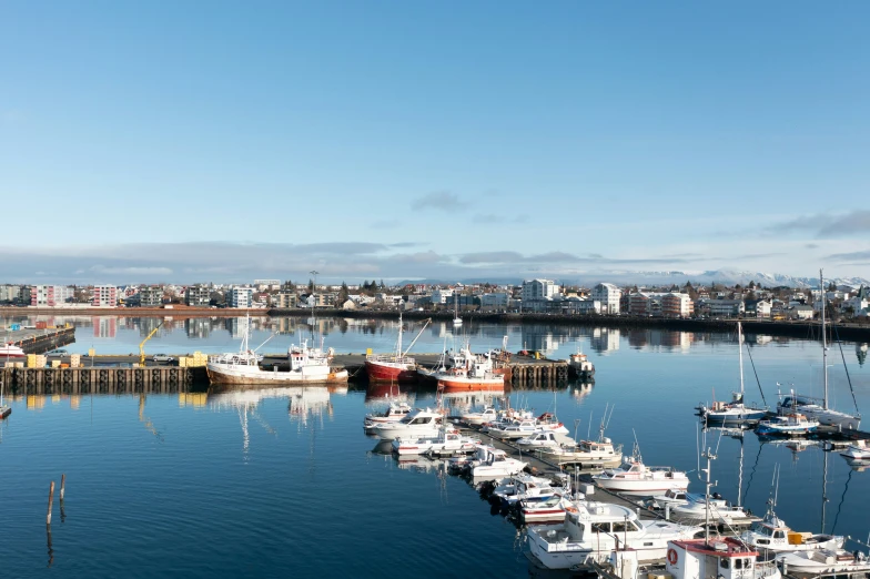 boats are parked in a harbor full of water