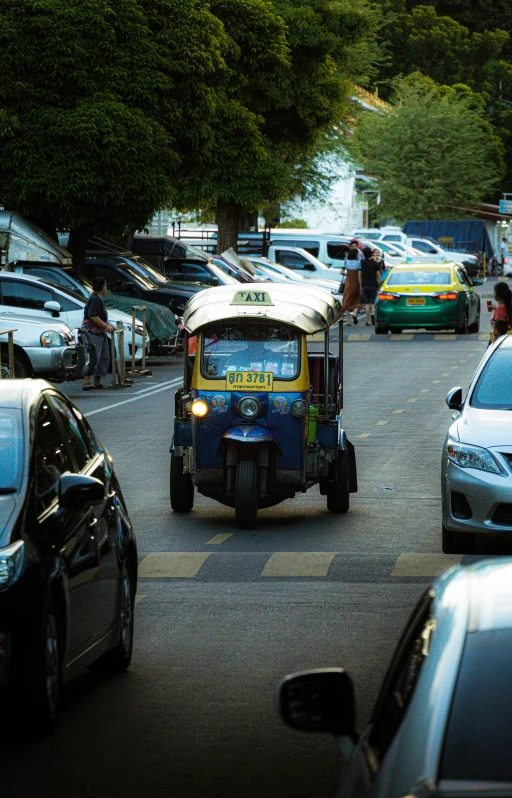 some cars and a man on a trolley