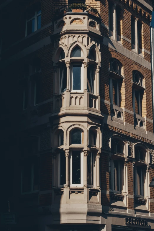 an older building with balconies on the windows