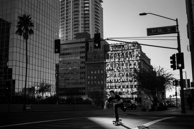 a boy on a skateboard near a street intersection