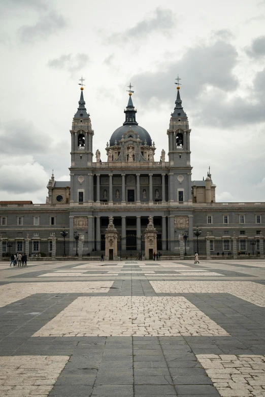 a large building with two clocks on the top of it