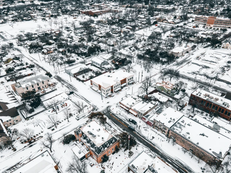 an aerial po of a large city in the snow