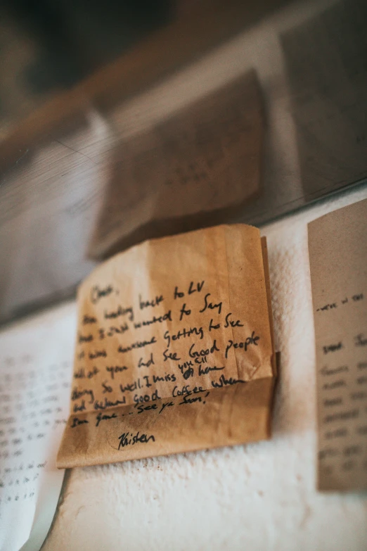 an old envelope and some old papers that are sitting on a desk