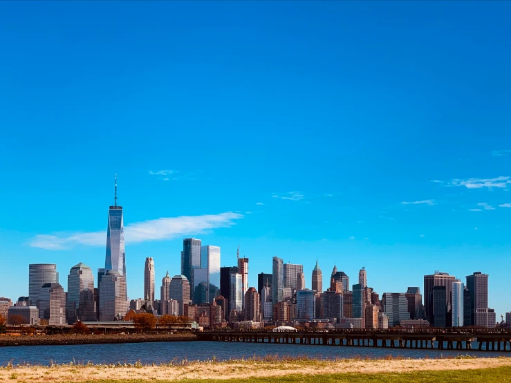 a city with many tall buildings and a river