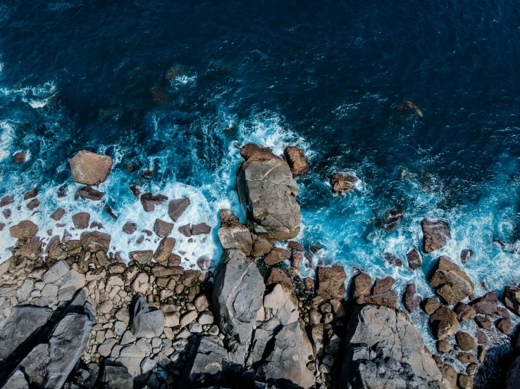 a large body of water surrounded by rocky coastline