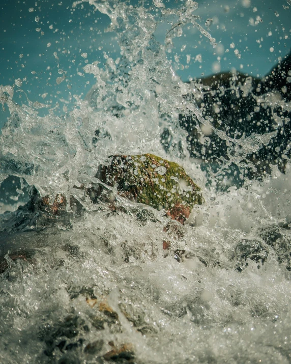 an ocean wave hitting on top of a person