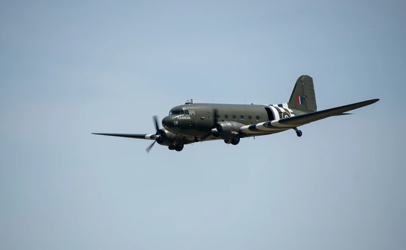 a large military plane flying in the sky