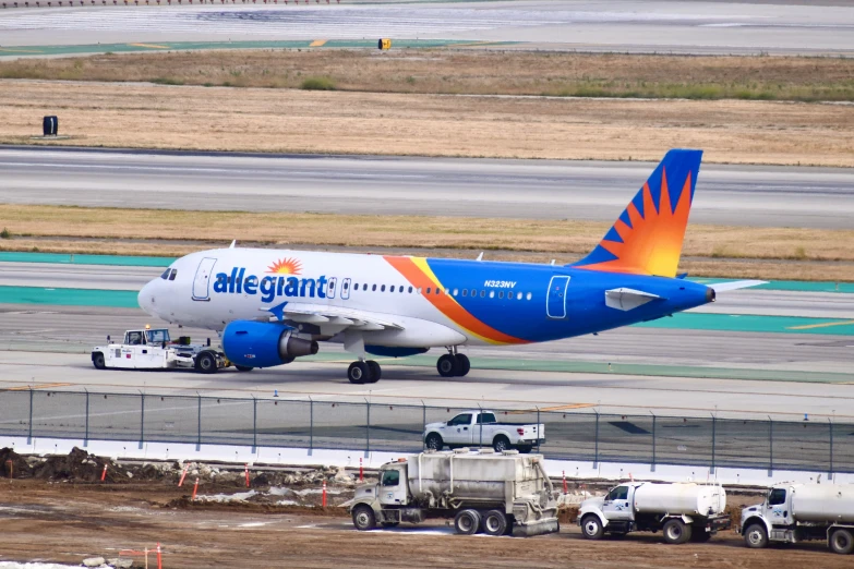 an airplane with the name alaskan on it parked at the airport