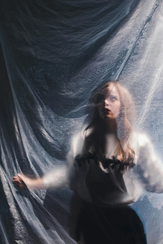 an extremely blurry image of a woman standing in a dark room