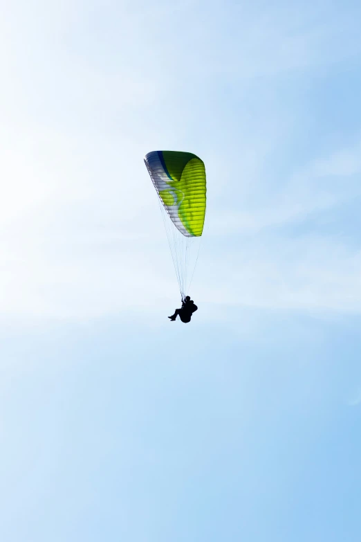 a kite is being lifted into the air by a parachute