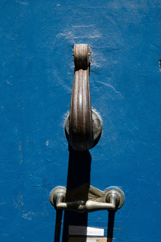 a chair against a wall in the middle of a blue area