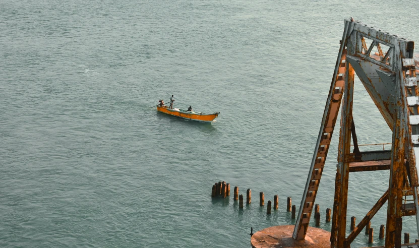 a group of people on a canoe are floating down the water