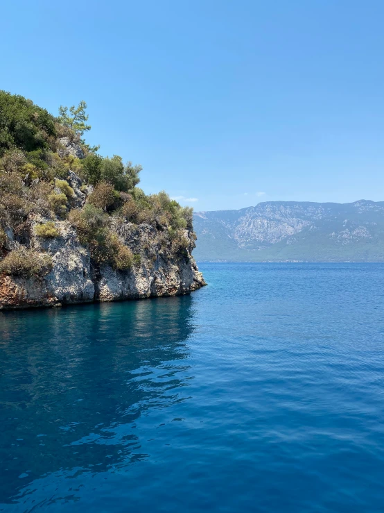 there is an island in the middle of blue water