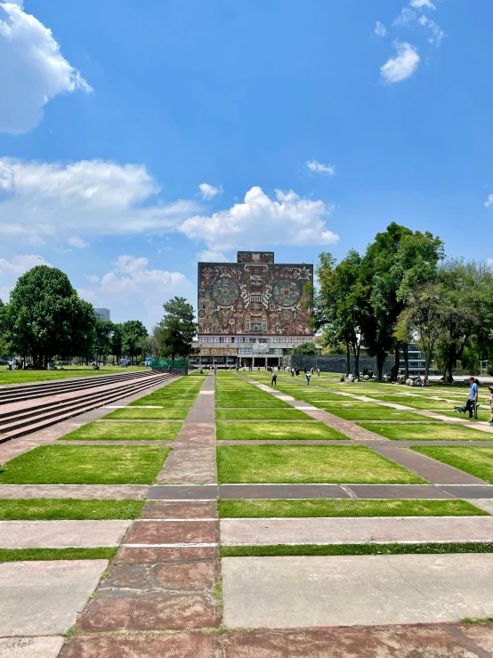 a brick building in a park on grass area