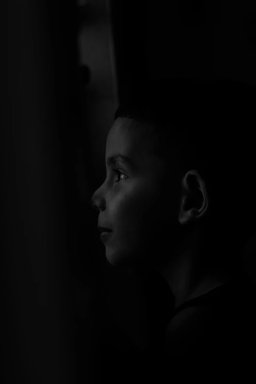 a black and white po of a child's profile