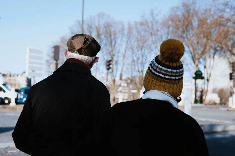 a couple of men on a city street