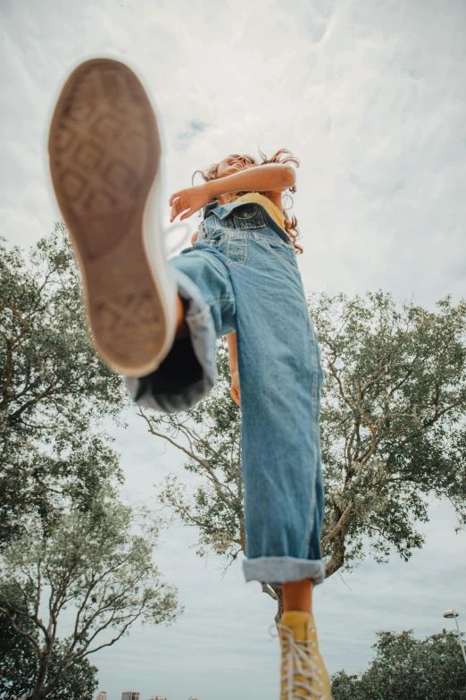 someones feet hanging upside down in a field