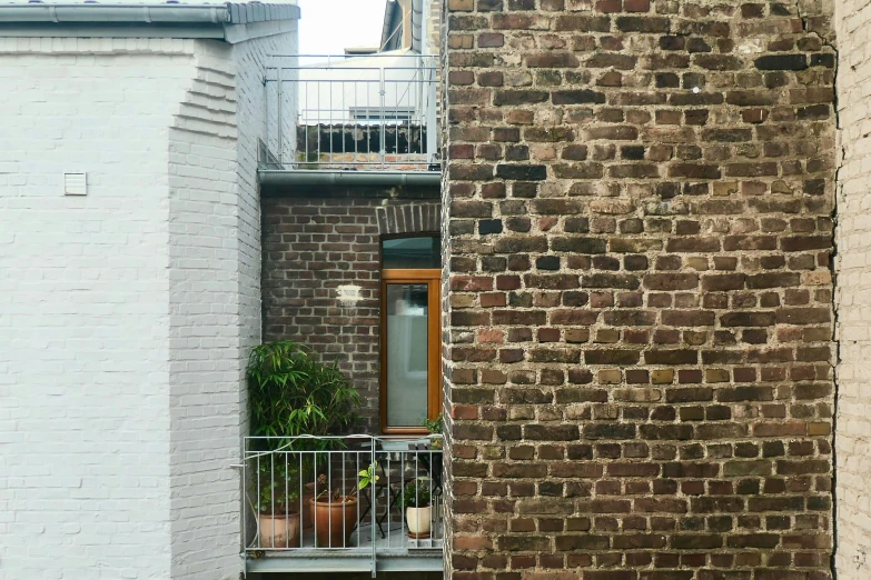 a balcony with a potted plant on top of it