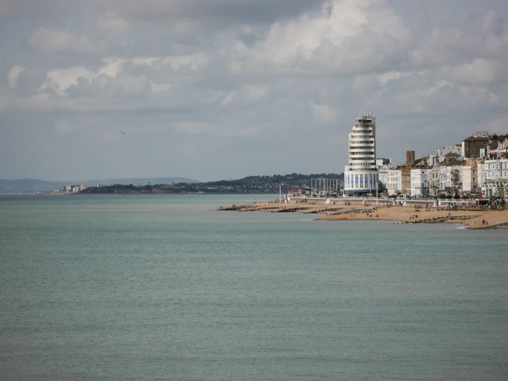 the beach with several buildings are in the distance