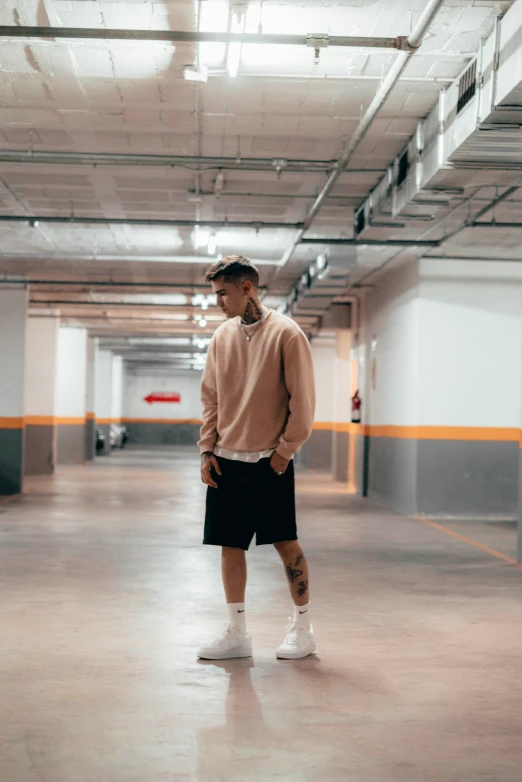 a person is standing in a parking garage