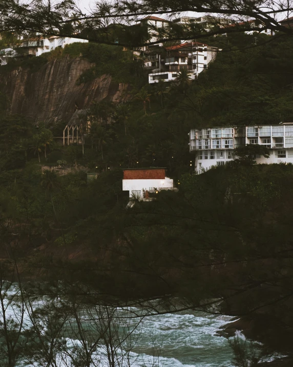 a city overlooking the ocean is nestled on the hillside