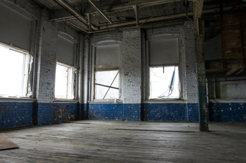 a room that has some floors and windows