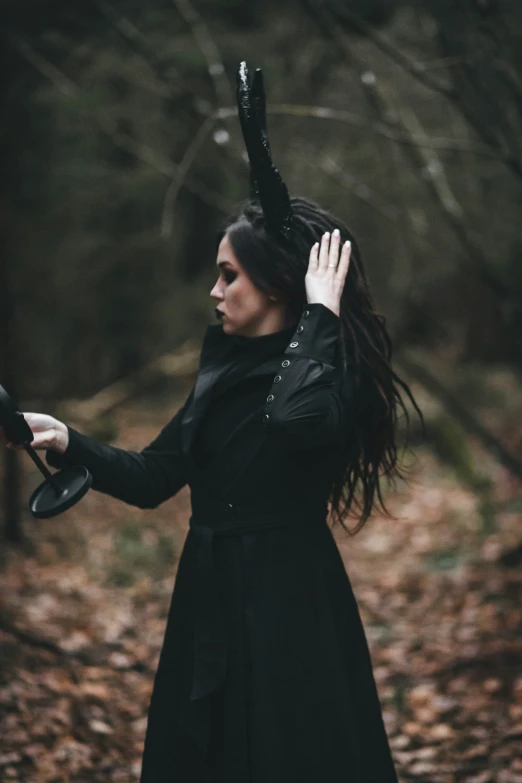 a person standing on leaves in a forest