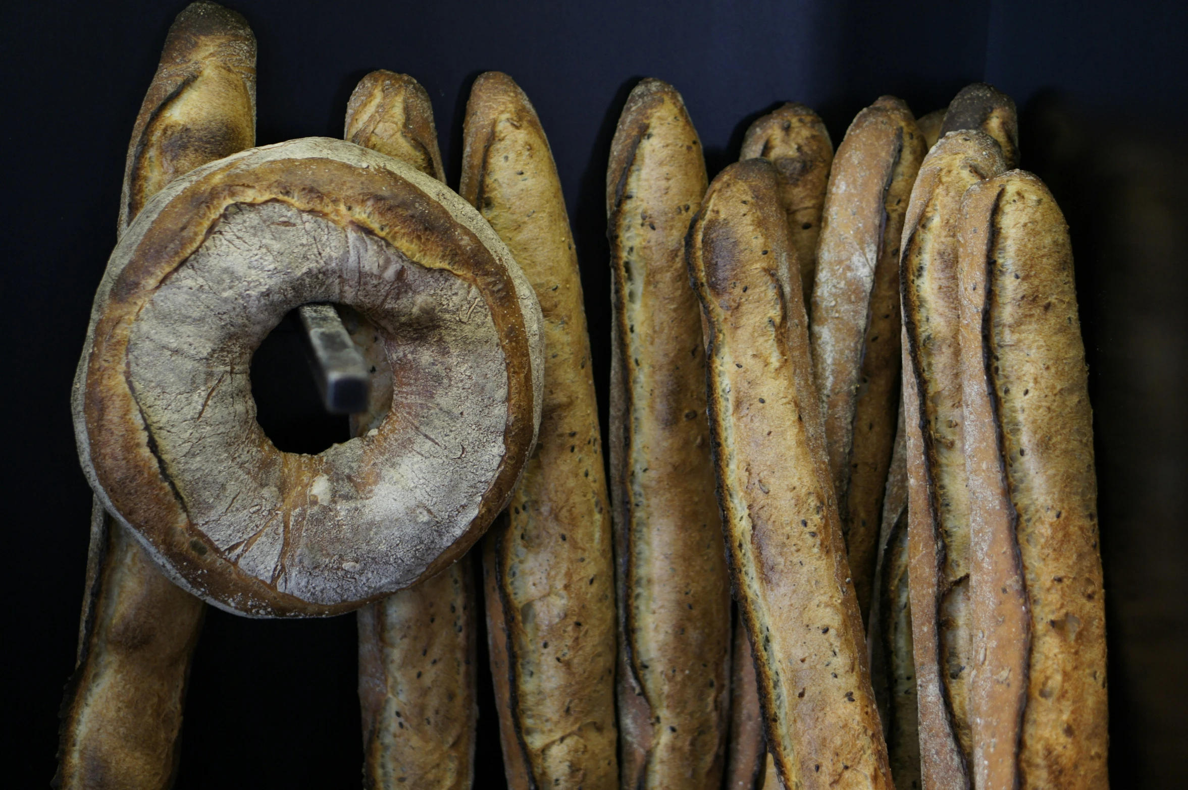 several breads are piled next to each other