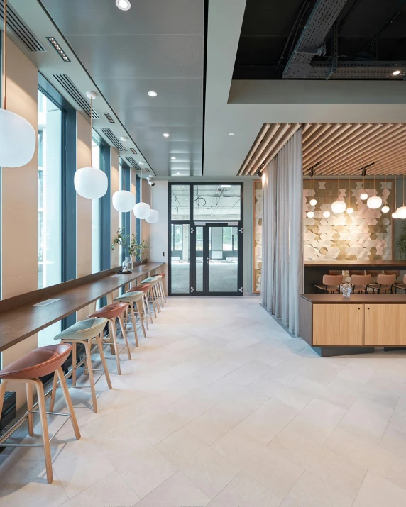 large dining area with marble countertops, hanging lights, and bar stools