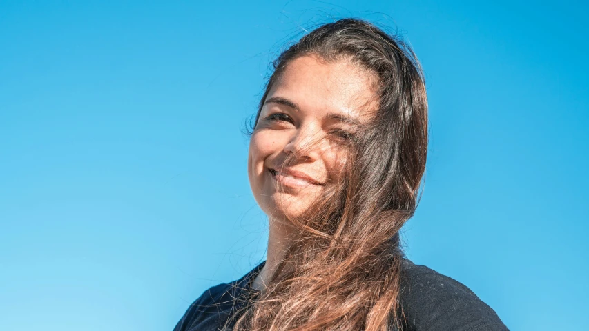 an image of a girl smiling on a sunny day