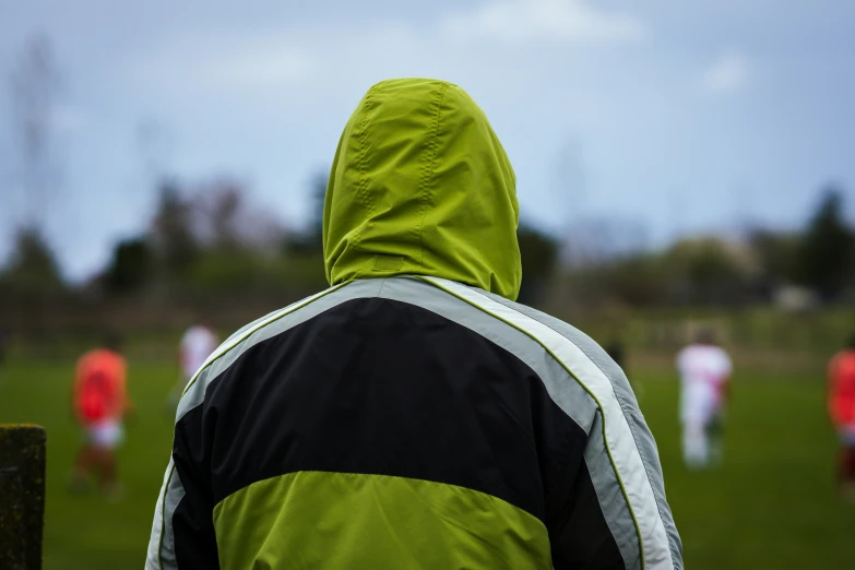 people play soccer in an open field